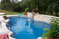 Fiberglass pool with water bar.