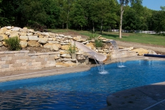 Fiberglass Pool with waterslide and fun fountain features.