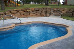 Elegant pool with stone wall
